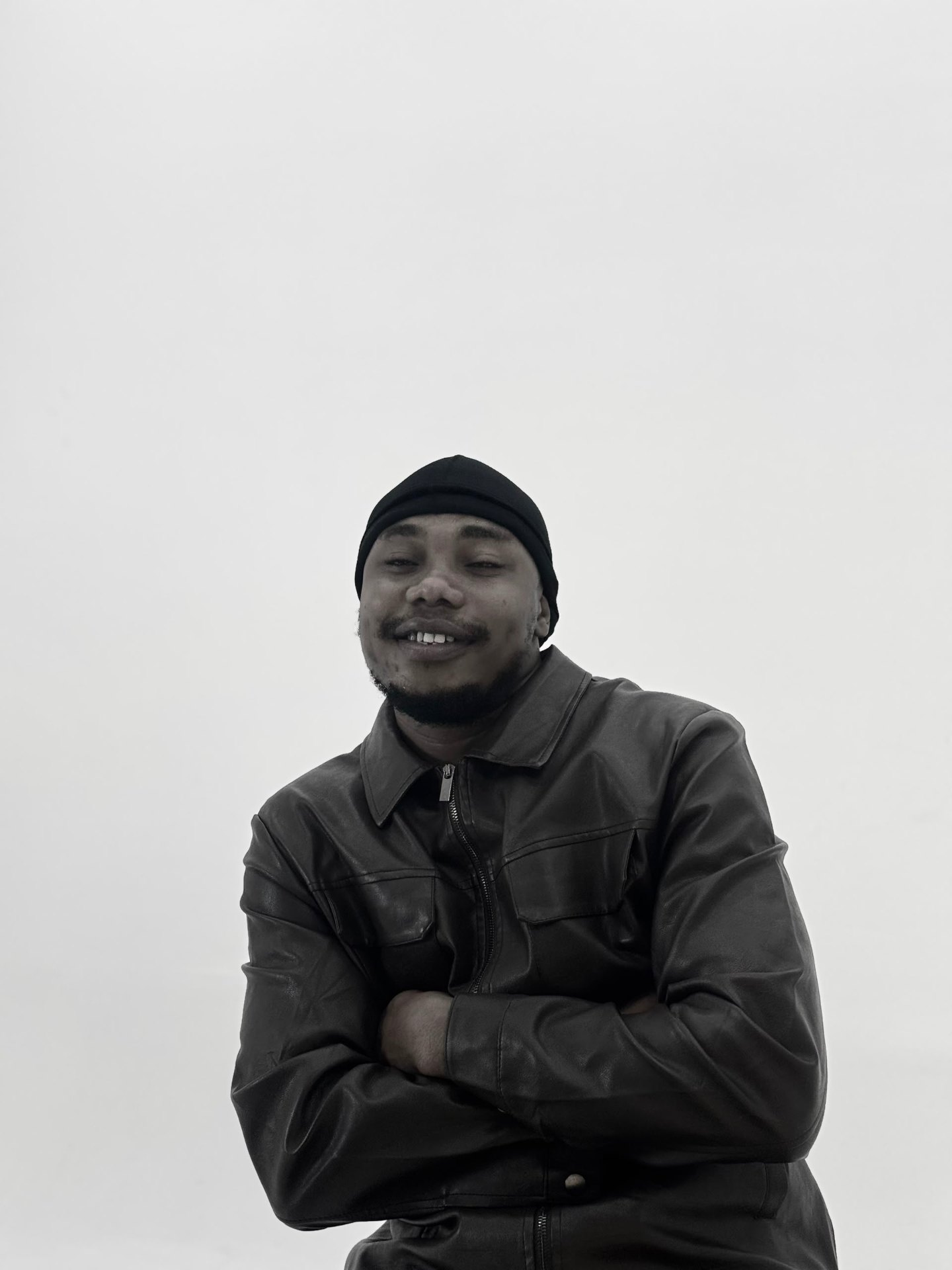 H3RITAGE — Editorial Leather Jacket Portrait H3RITAGE in a black leather jacket — official editorial studio portrait