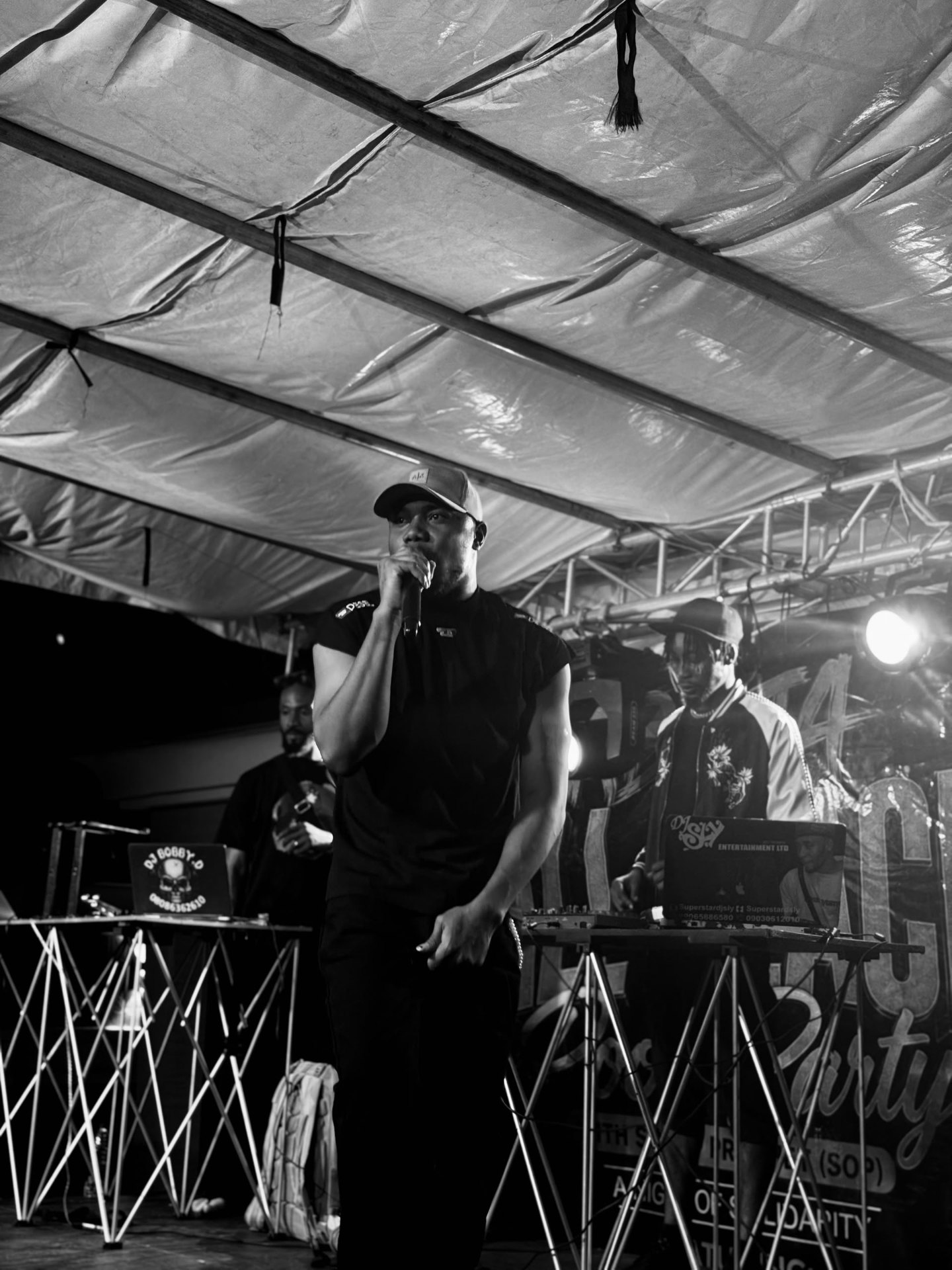 H3RITAGE — Black & White Editorial H3RITAGE at the microphone — official editorial black-and-white portrait